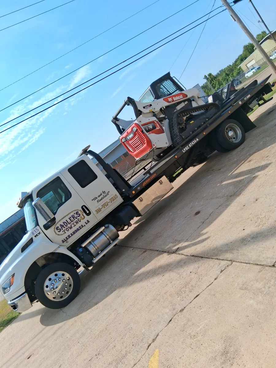 Bobcat skid steer loaded on a Sadler's Towing rollback